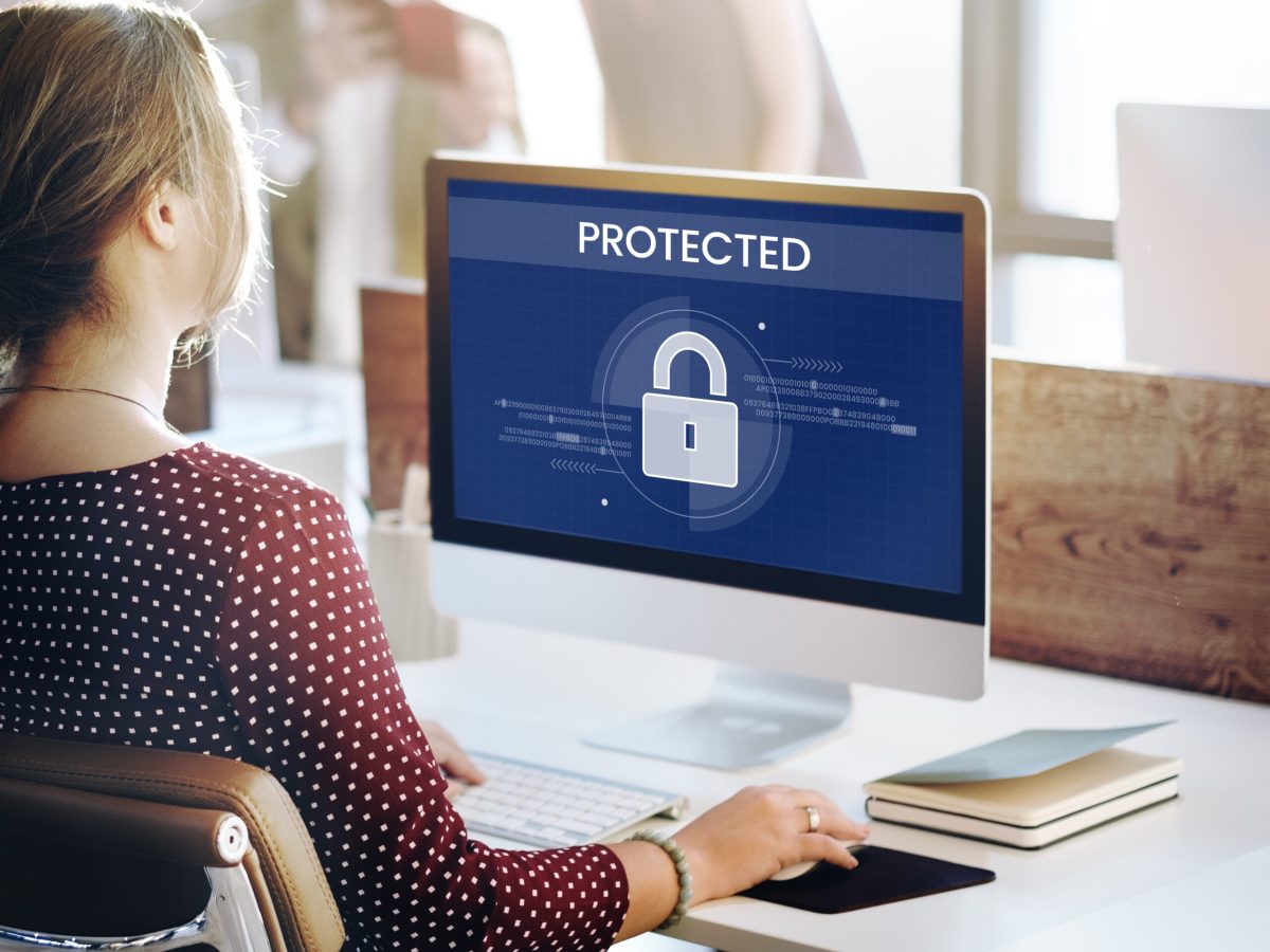 Woman working on computer network graphic overlay